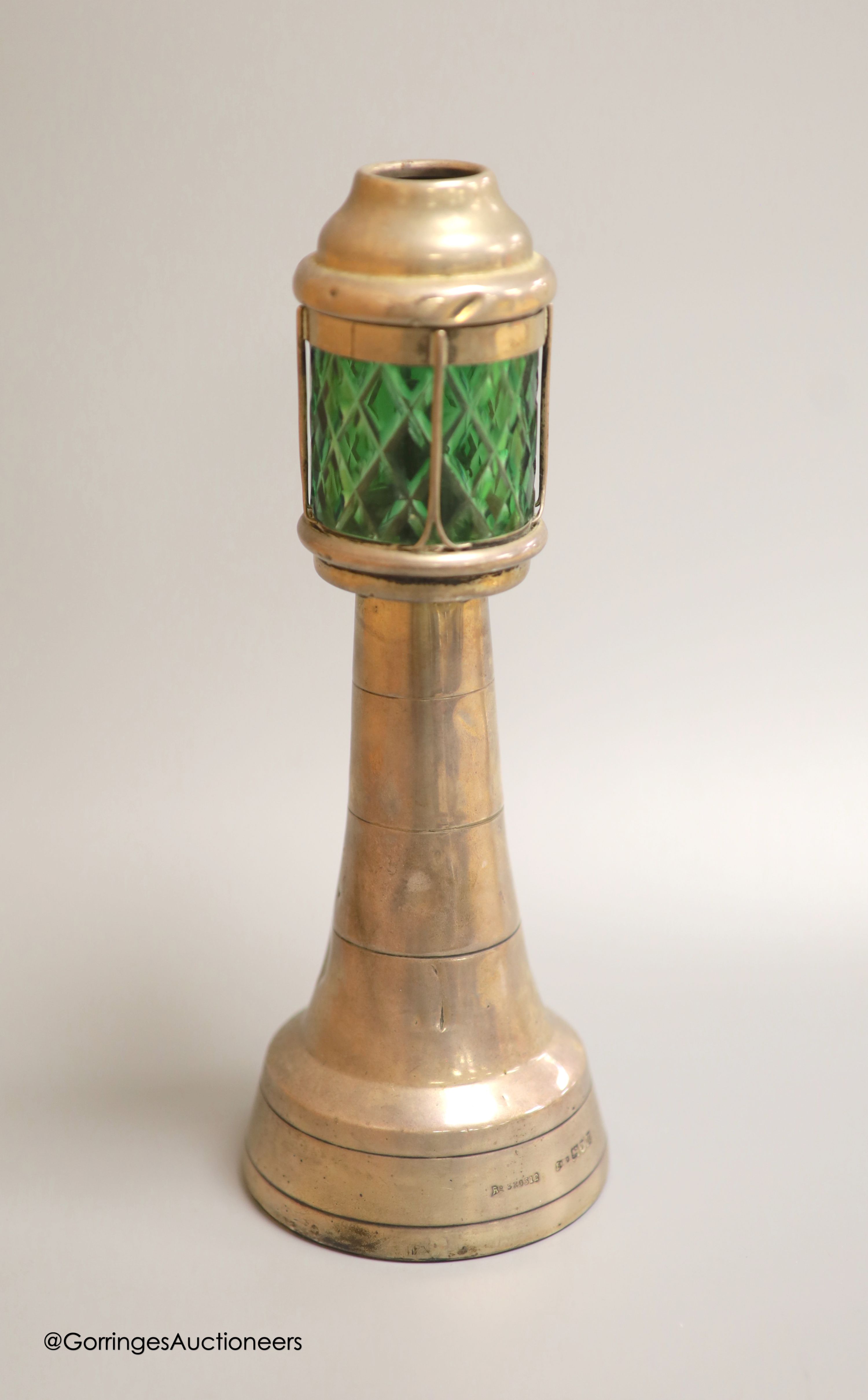 An Edwardian silver and green glass mounted novelty table lighter, modelled as a lighthouse, by Grey &Co, London, 1907/8, 25.4cm, (a.f.)